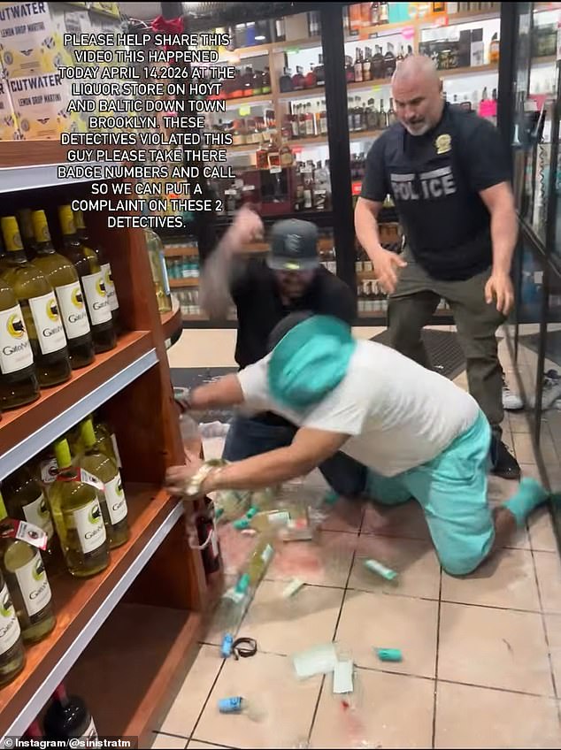 The detectives could also be seen pushing the suspect into a shelf of wine bottles which shattered and slashed his leg