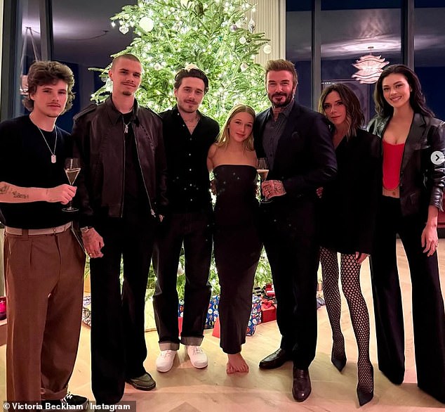 Victoria said of daughter Harper, 'She's very appropriate, which I think is really important as well' (L-R) Cruz, Romeo, Brooklyn, Harper, David and Victoria Beckham and Nicola Peltz