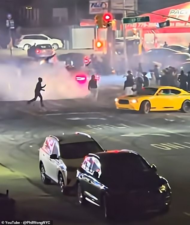 Videos from the scene show spectators lining the roadway as cars performed donuts and burnouts, with some people stepping back at the last moment to avoid oncoming vehicles