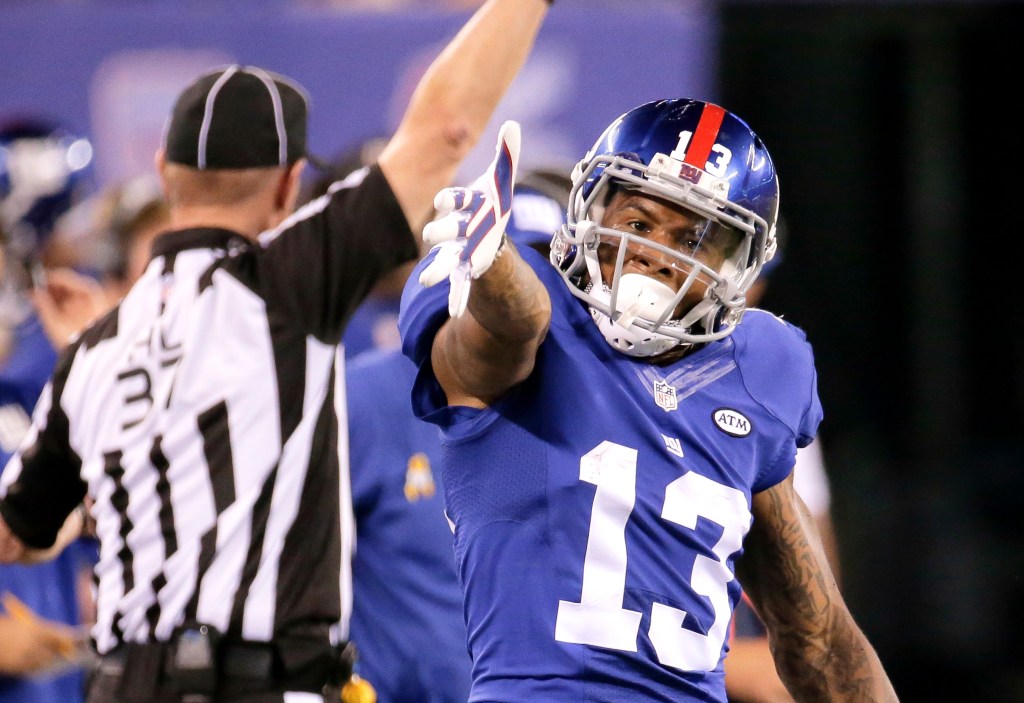 Giants Odell Beckham Jr. reacts after he completes a pass during the second half of their NFL game in East Rutherford, September 24, 2015. 