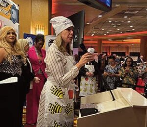 Patricia Ornst is seen addressing the crowd while accepting her award.