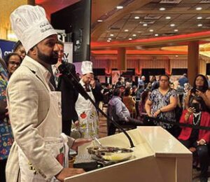 Richard S. David strikes a pose after being hon­ored by QCP.