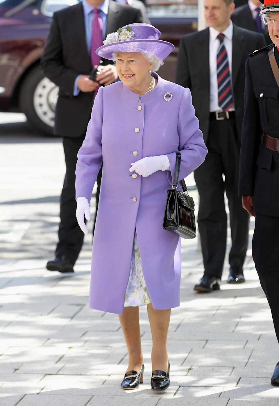 The late Queen’s style was often distilled into a block colour dress coat with a matching hat<span> Credit: Chris Jackson/PA</span>