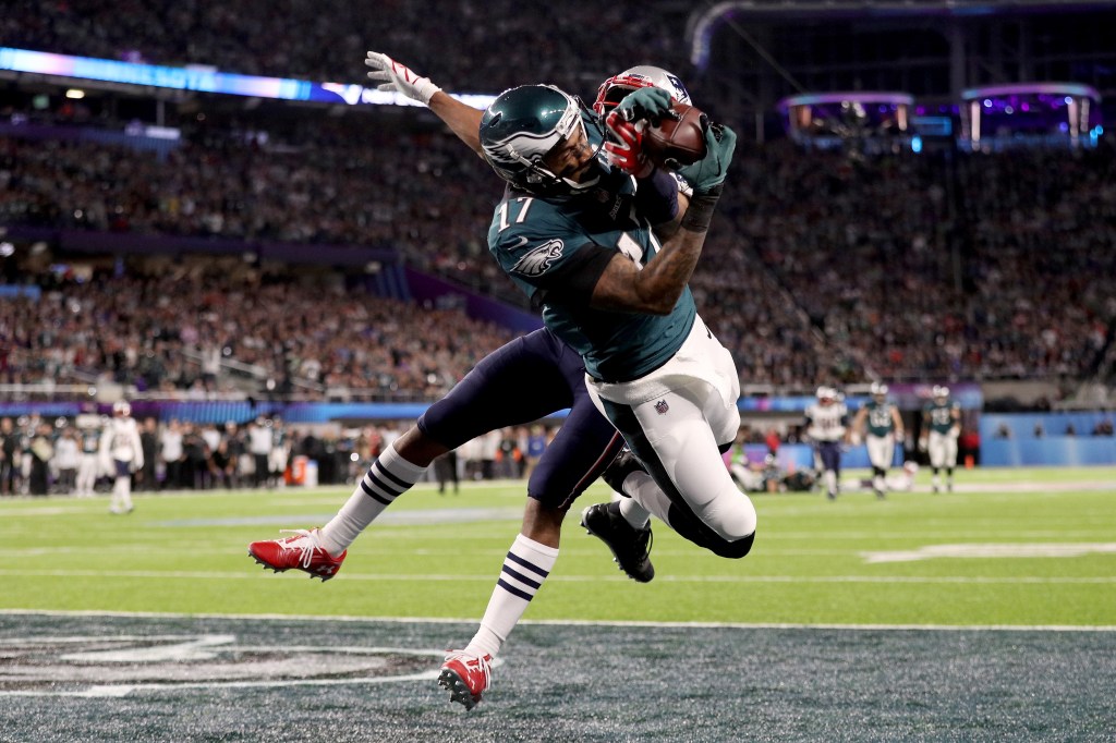 Alshon Jeffery #17 of the Philadelphia Eagles catches a 34 yard pass, over Eric Rowe #25 of the New England Patriots, for a touchdown during the first quarter in Super Bowl LII at U.S. Bank Stadium on February 4, 2018 in Minneapolis, Minnesota.  