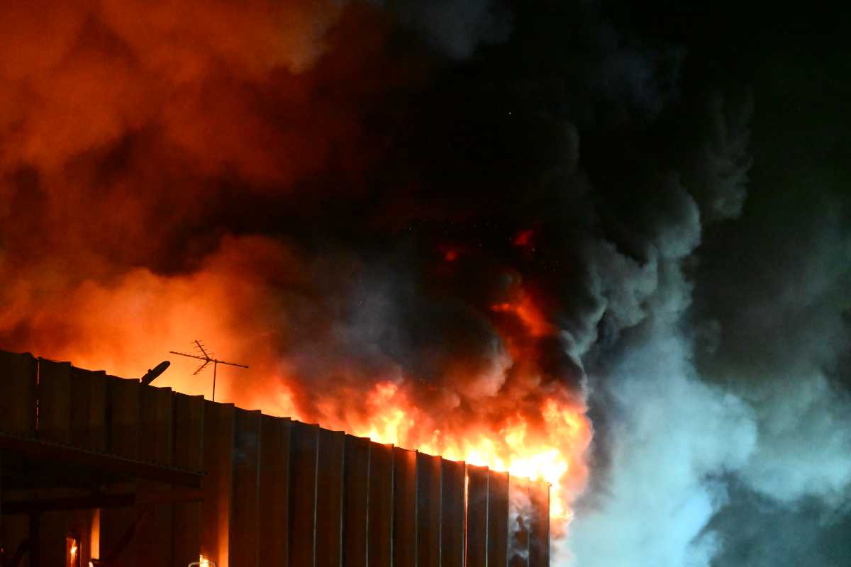 heavy flames and smoke pour out of Queens building during five-alarm fire