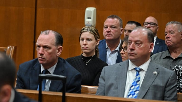 Widow Stephanie Diller, center, is seen at Queens Criminal Court...