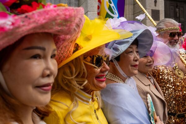 People participate in the Easter Bonnet Parade on Fifth Avenue, Sunday, April 5, 2026, in New York. (AP Photo/Adam Gray)