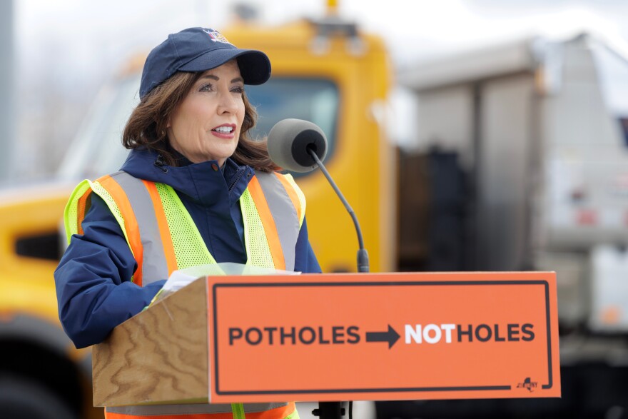 Gov. Kathy Hochul joins a New York state Department of Transportation crew to fill potholes on April 6, 2026, and announce statewide road improvement efforts.