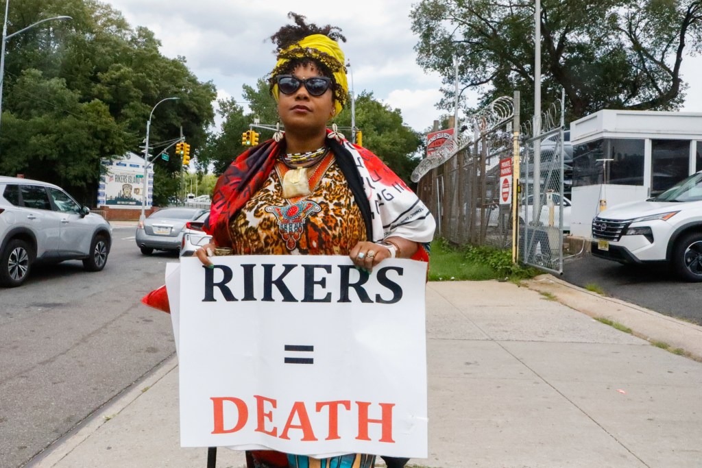 Chaplain Dr. Victoria A. Phillips joins a rally outside Rikers Island.
