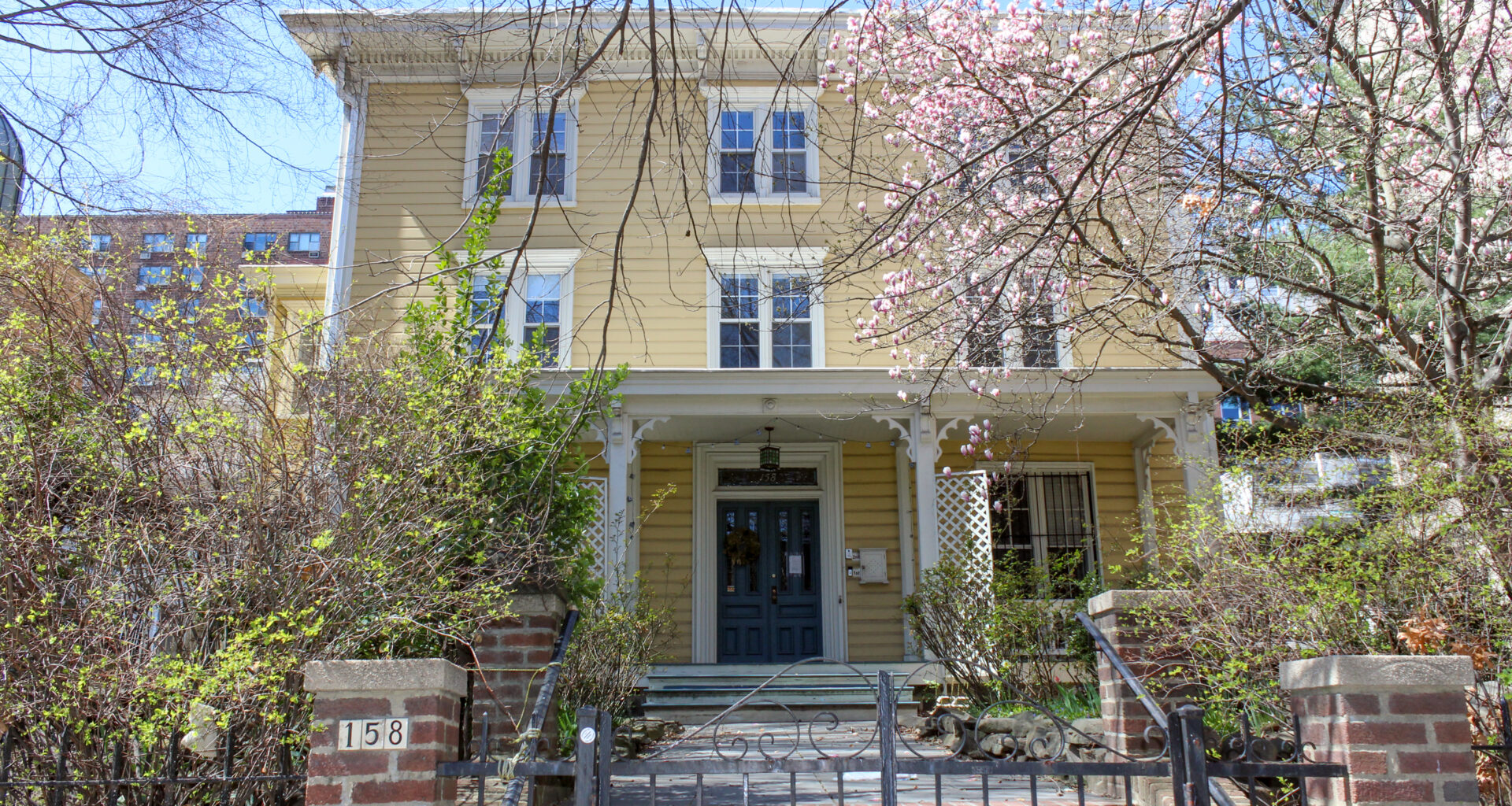 fort greene - a yellow wood frame house