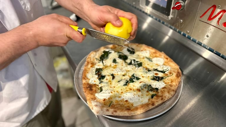 The Green Vespa pie, with mozzarella, ricotta, baby spinach and...