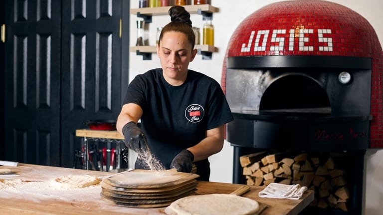 Owner Josie Giglio makes a pie at Josie's Pizza Bar...