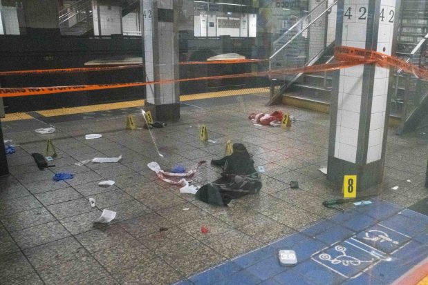 The scene on the subway platform on Saturday after cops shot and killed Anthony Griffin.