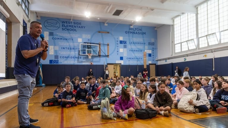 Principal John Barnes at a morning assembly Monday.