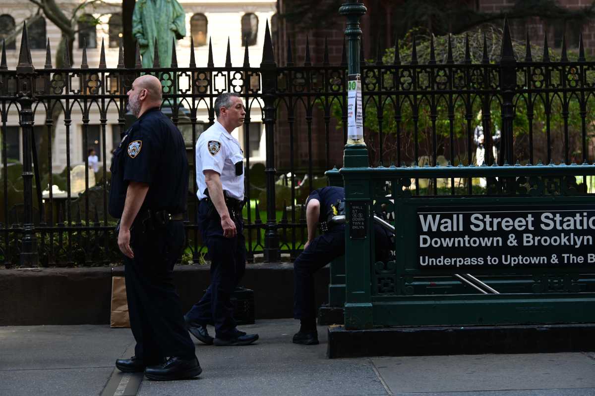 scene of police at scene of Lower Manhattan subway stabbing near closed entrance to station
