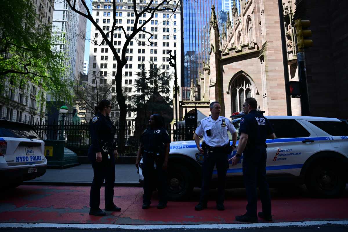 scene of police at scene of Lower Manhattan subway stabbing near closed entrance to station