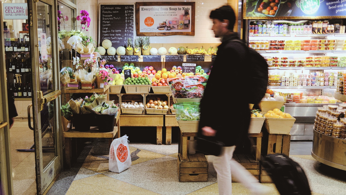 People shopping for fruit in a grocery store in Manhattan New York City