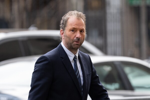 Michael Rapino, chief executive officer and president of Live Nation Entertainment Inc., arrives at Manhattan Federal court, Thursday, March 19, 2026 in New York. (AP Photo/Adam Gray)