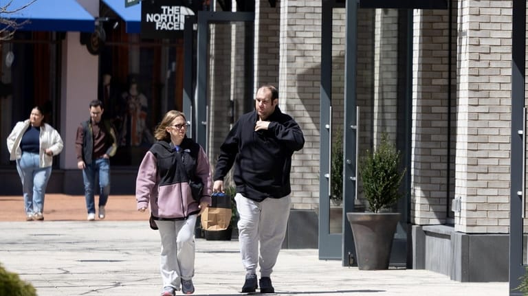 Syosset resident Robert Hornik, right, visited Belmont Park Village recently...