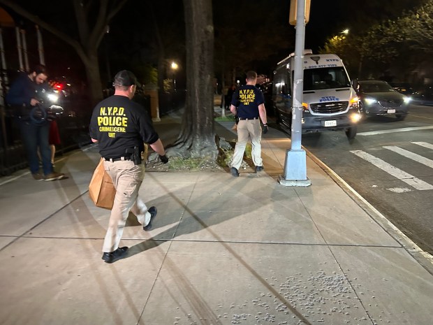 Police investigate the scene where a 15 year-old boy was shot and killed in Roy Wilkins Park in St Albans, Queens on Thursday, April 16, 2026. Kerry Burke/New York Daily News)