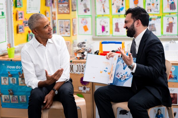 Former President Barack Obama and Mayor Zohran Mamdani take part in a shared reading event at Learning Through Play Pre-K in the Bronx in New York, Saturday, April 18, 2026. (AP Photo/Angelina Katsanis)