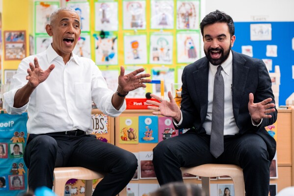 Former President Barack Obama and Mayor Zohran Mamdani sing 'Wheels on the Bus' during a shared reading event at Learning Through Play Pre-K in the Bronx in New York, Saturday, April 18, 2026. (AP Photo/Angelina Katsanis)