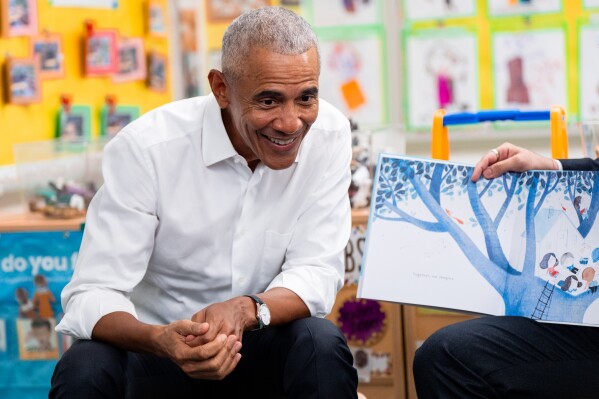 Former President Barack Obama, accompanied by Mayor Zohran Mamdani, take part in a shared reading event at Learning Through Play Pre-K in the Bronx in New York, Saturday, April 18, 2026. (AP Photo/Angelina Katsanis)