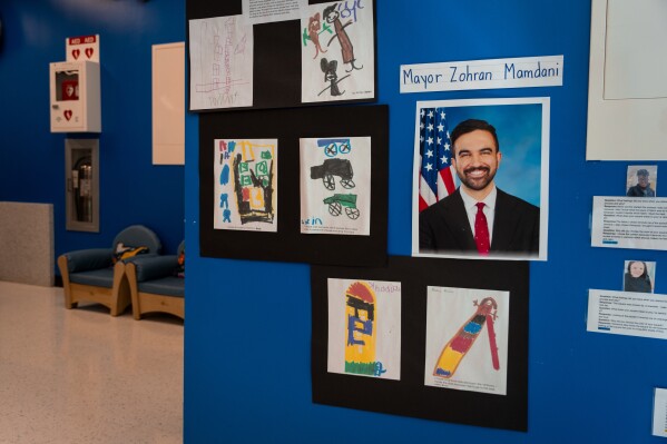 A printed photo of Mayor Zohran Mamdani hangs at Learning Through Play Pre-K in the Bronx in New York, Saturday, April 18, 2026. (AP Photo/Angelina Katsanis)