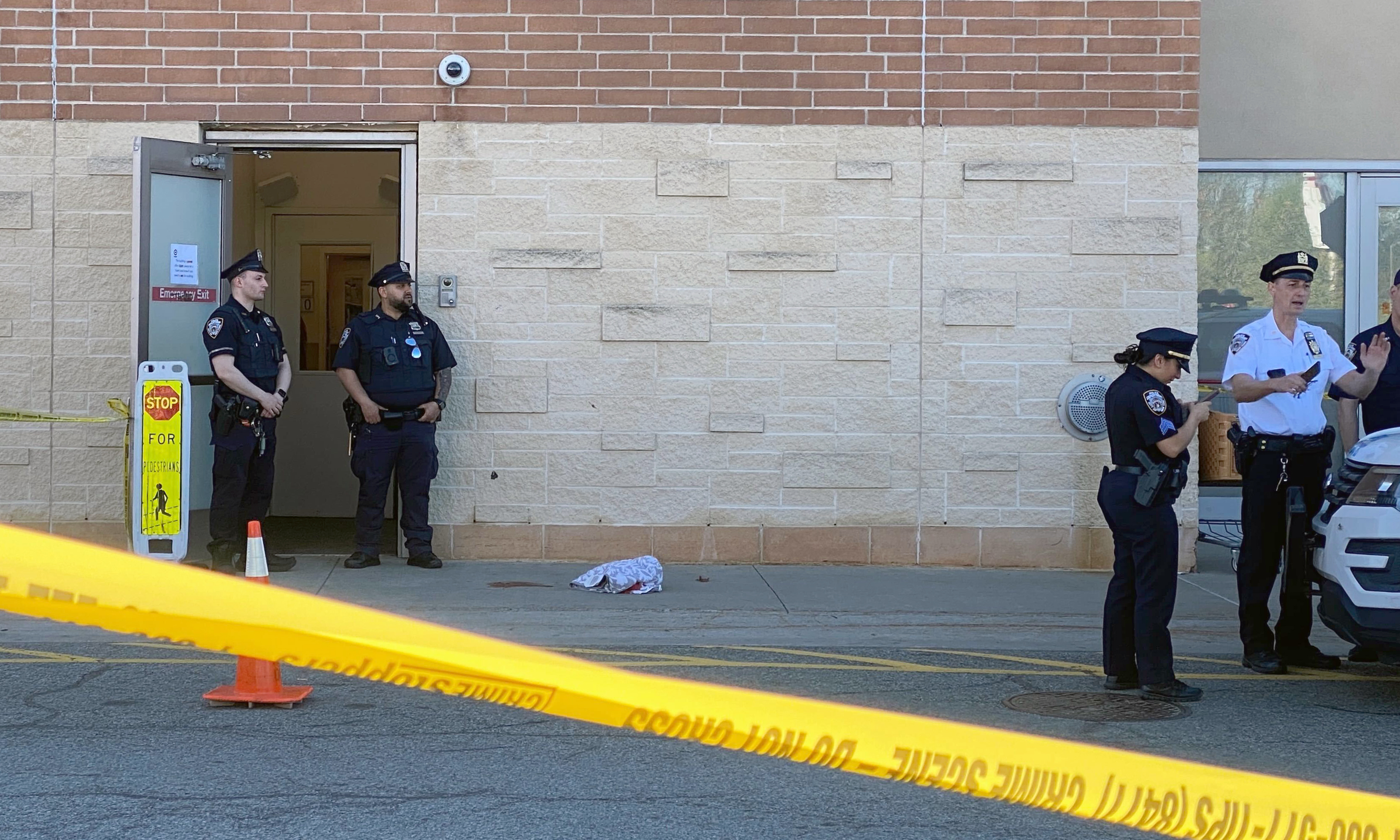 Police investigate after a woman was shot at the Target store on Richmond Ave. near Forest Hill Road in Staten Island on Friday morning.