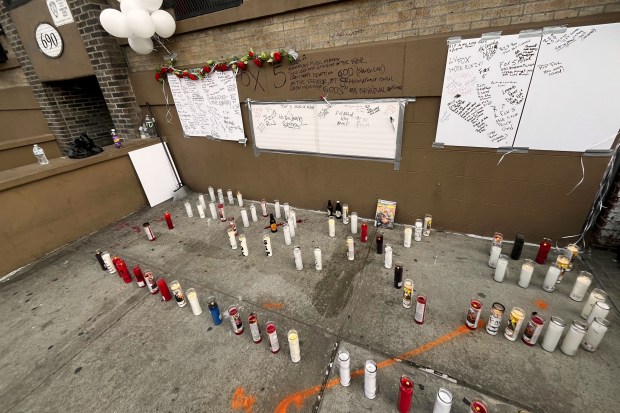 A memorial for Anthony Griffin is pictured on Sunday outside the Mott Haven building he grew up in.