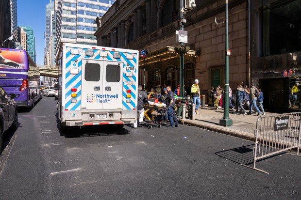An ambulance is pictured outside Grand Central Terminal after cops shot and killed a man who slashed three elderly commuters on the uptown 4/5/6 subway platform inside Grand Central Terminal on E. 42nd St. near Park Ave. in Manhattan on Saturday, April 11, 2026. (Theodore Parisienne / New York Daily News)