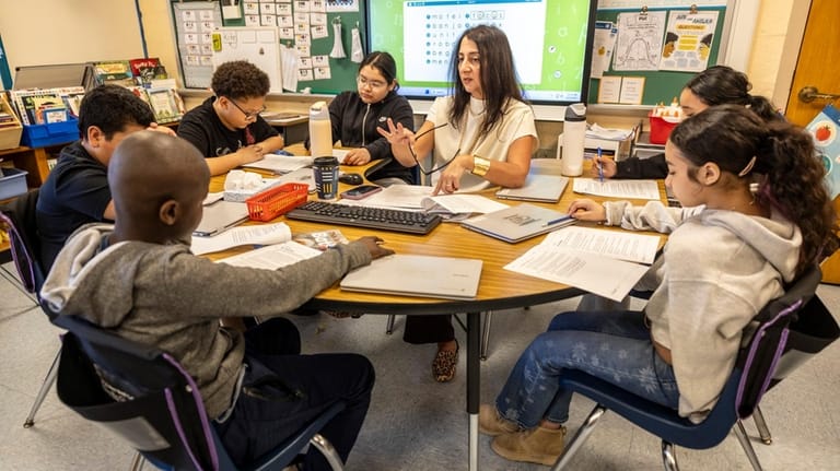 Literacy teacher Michelle Corcione with students.