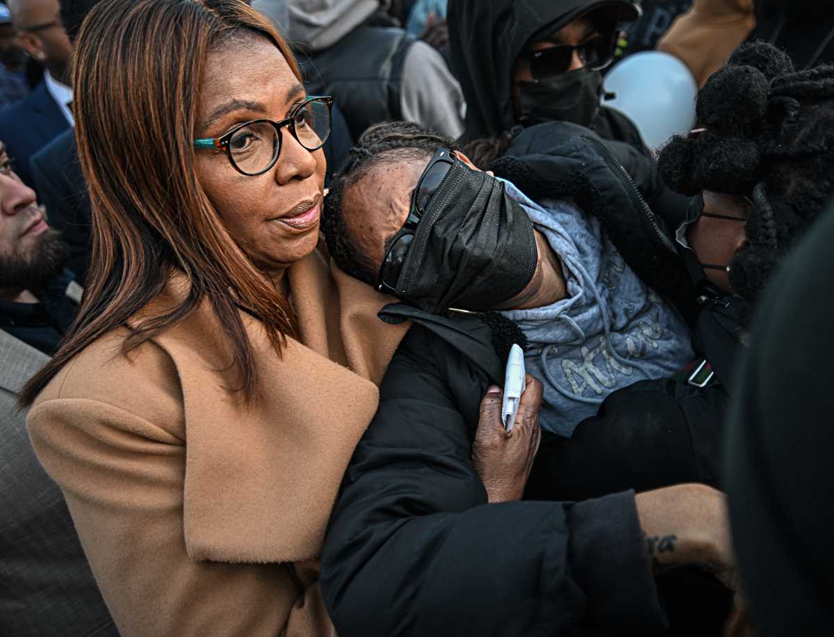 Mother of slain Queens teen embraced by woman at vigil
