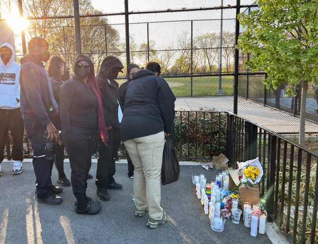Family members of Jaden Pierre pray together in Roy Wilkins Park during a vigil on Monday, April 20, 2026. (Kerry Burke/New York Daily News)