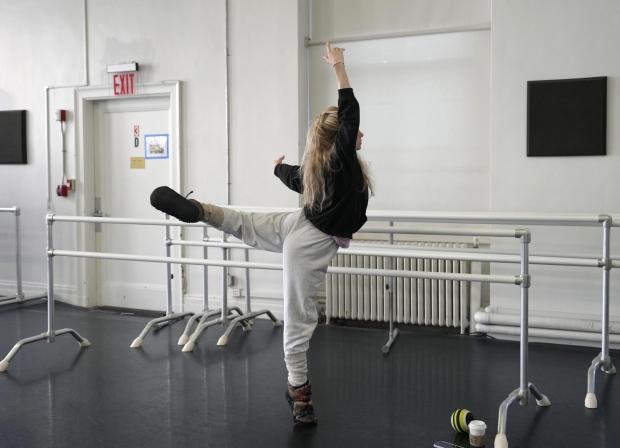Sara Mearns, principal dancer at New York City Ballet, warms up.