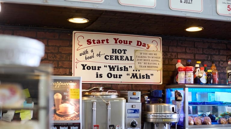 A sign reads, Your "Wish" is Our "Mish."