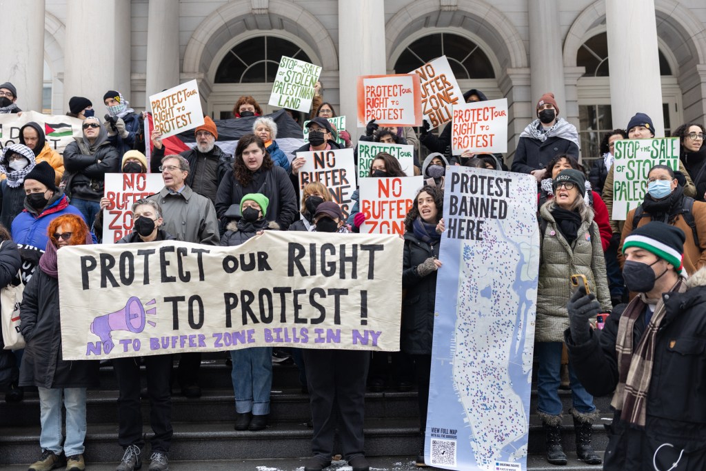 Free speech advocates protest at City Hall against a bill to create a protest buffer zone around schools and houses of worship,