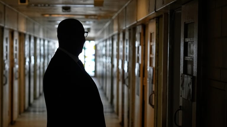 Stanley Richards, NYC Department of Correction commissioner, looks at the...