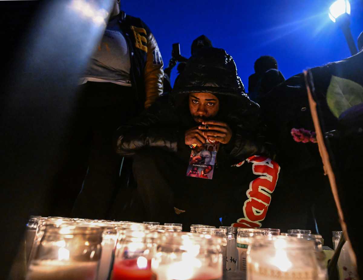 Queens residents at a memorial vigil for Jaden Pierre on April 20 at Roy Wilkins Park. 