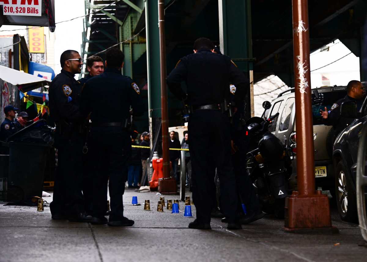 FILE - Police at a shooting scene in Brooklyn.