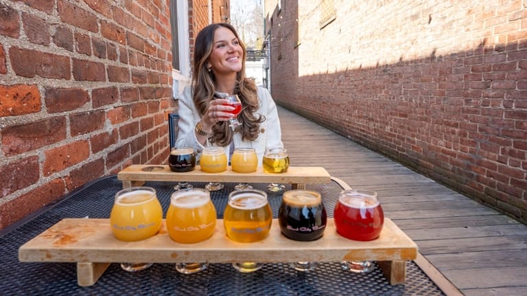 Travel writer Carissa Kellman tries a flight of brews at...