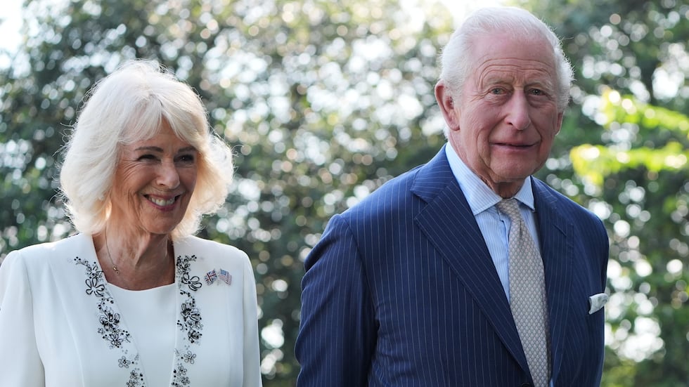 Britain's King Charles III and Queen Camilla stand next to the White House bee hive on the...