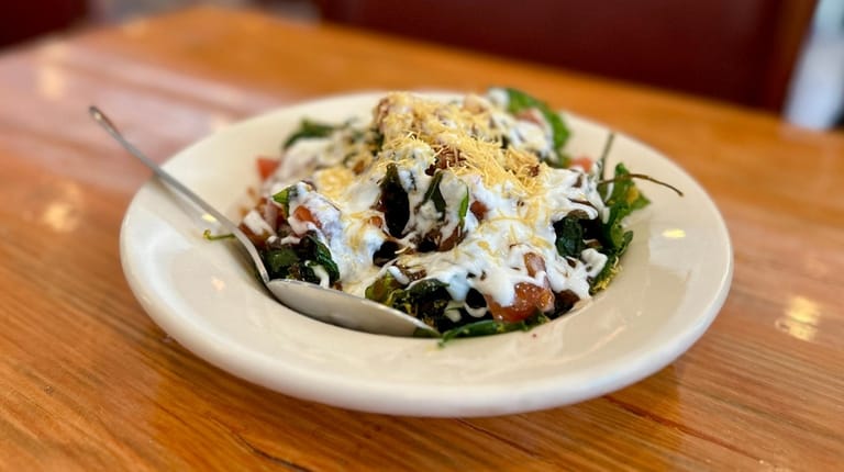 Paalak patte ki chaat, a sort of fried spinach salad,...