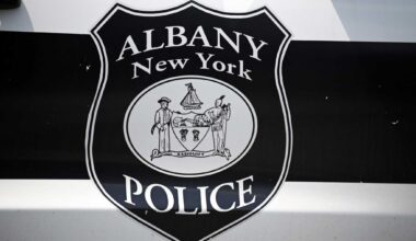 An Albany Police Department shield is pictured on a police car outside the department’s Center Station on Monday, July 28, 2025, on Western Ave. in Albany, N.Y.