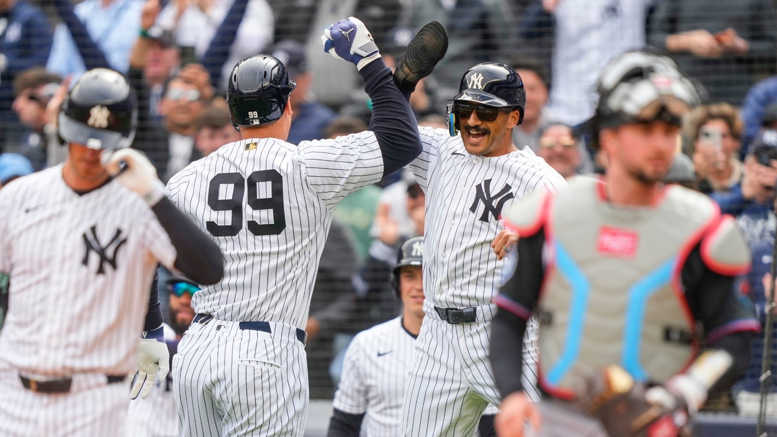 The New York Yankees win home opener 8-2 against the Miami Marlins in first of 3-game series at Yankee Stadium in the Bronx