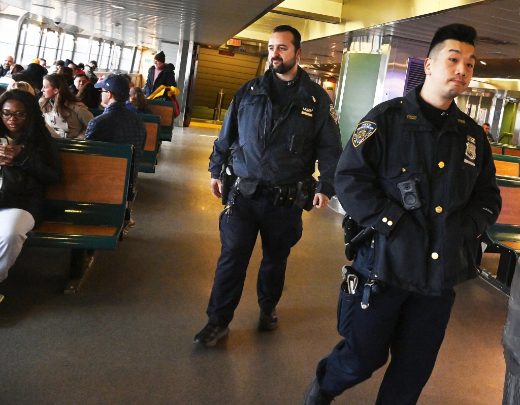 Cops are seen walking around the Staten Island ferry.