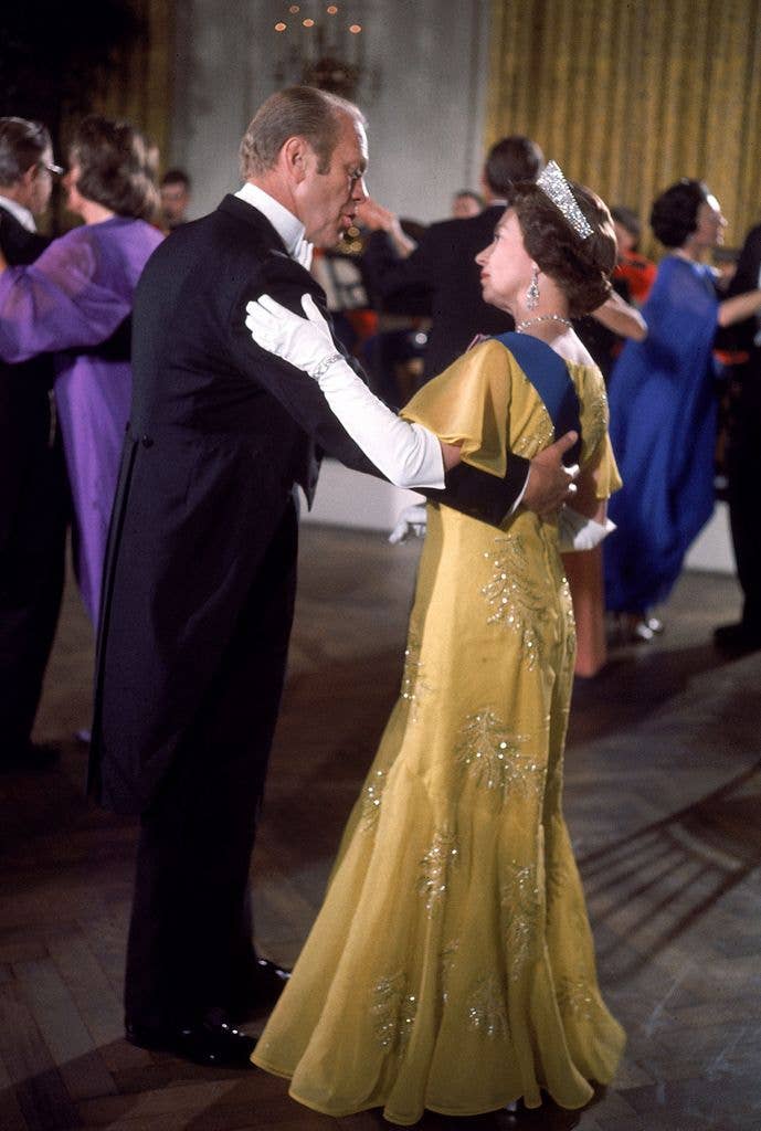 President Gerald Ford dances with Britain's Queen Elizabeth during a White House State Dinner honoring the Queen US Bicentennial visit, Washington DC, July 7, 1976.   (Photo by Dirck Halstead/Getty Images)