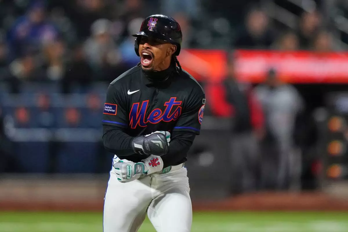 New York Mets' Francisco Lindor celebrates after hitting a three-run home run during the third inning of a baseball game against the Minnesota Twins Tuesday, April 21, 2026, in New York. (AP Photo/Frank Franklin II)