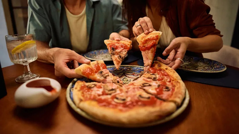 Couple sharing pizza