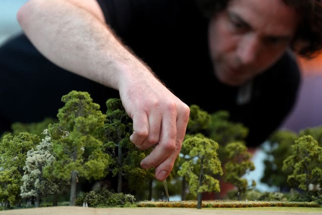 The finishing touches being applied to a model of St James’s Park in London during a preview for the Queen Elizabeth exhibition at the British Museum 